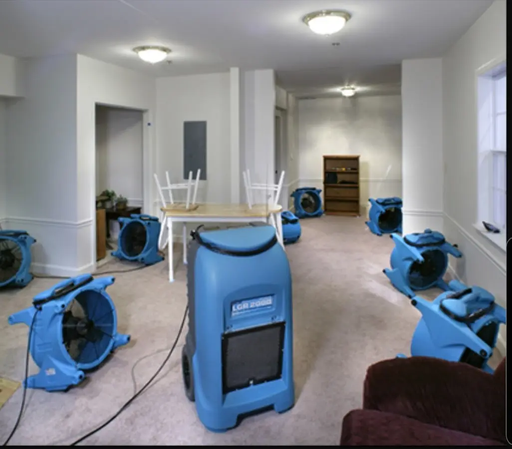 Air movers and dehumidifier setup for Water Damage Restoration in Zanesville
